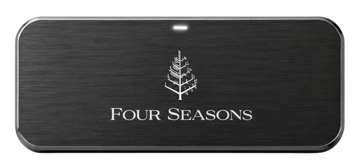 Harlow badge for Four Seasons, front face, engraved with a property mark