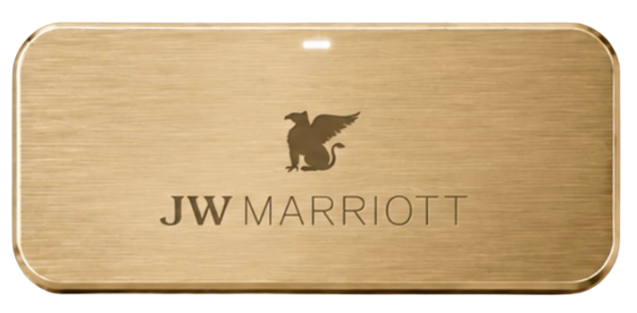 Harlow badge for JW Marriott, front face, engraved with a property mark